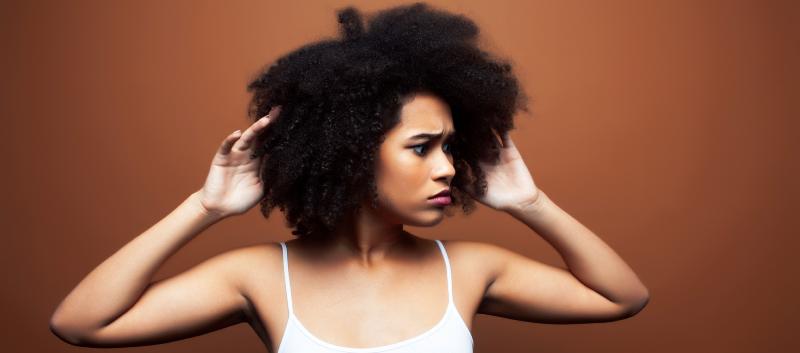 How to reduce volume and frizz in coily and kinky hair